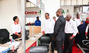 Huduma Kenya  Mombasa Centre Manager walks CS around the centre