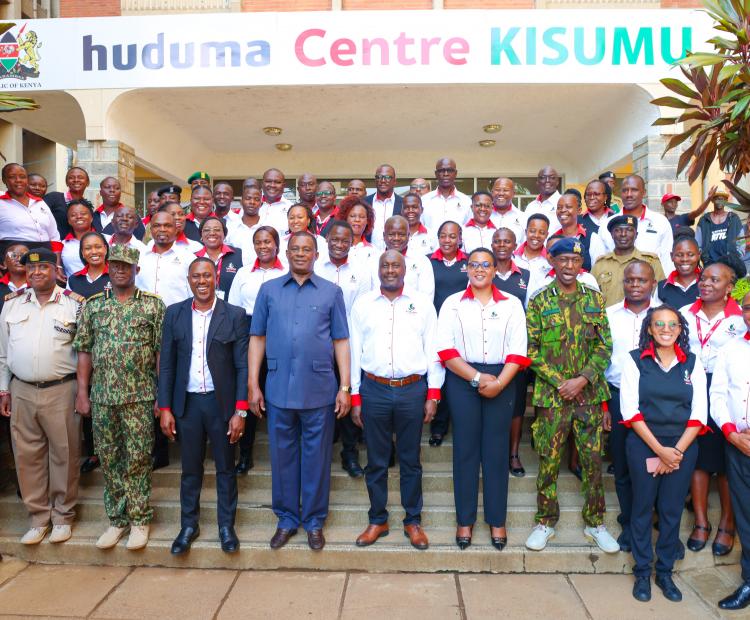 CS in a group Photo with Huduma Staff Kisumu County